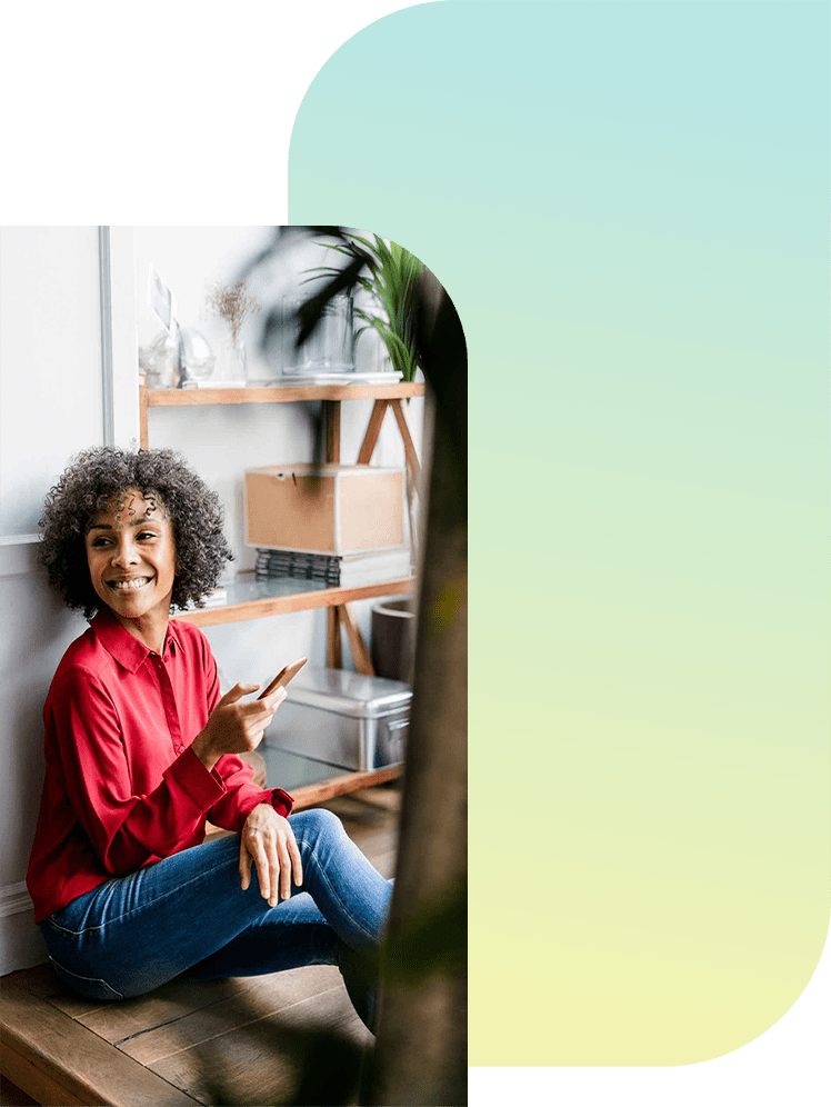 Lady sitting down trading on Clarity App