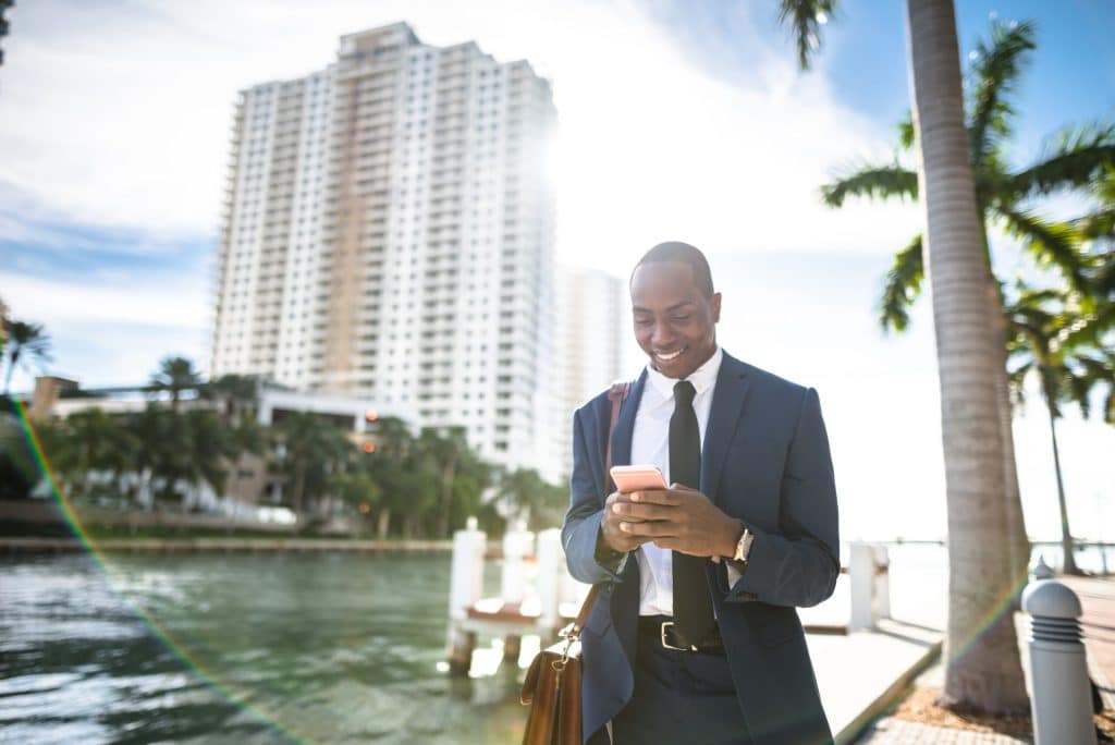 Businessman trading on an smartphone