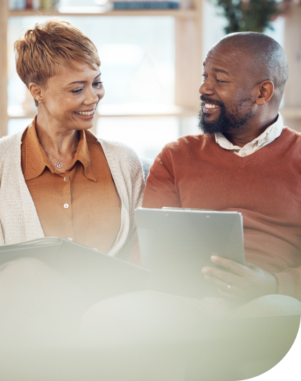 Husband and Wife reviewing their investments